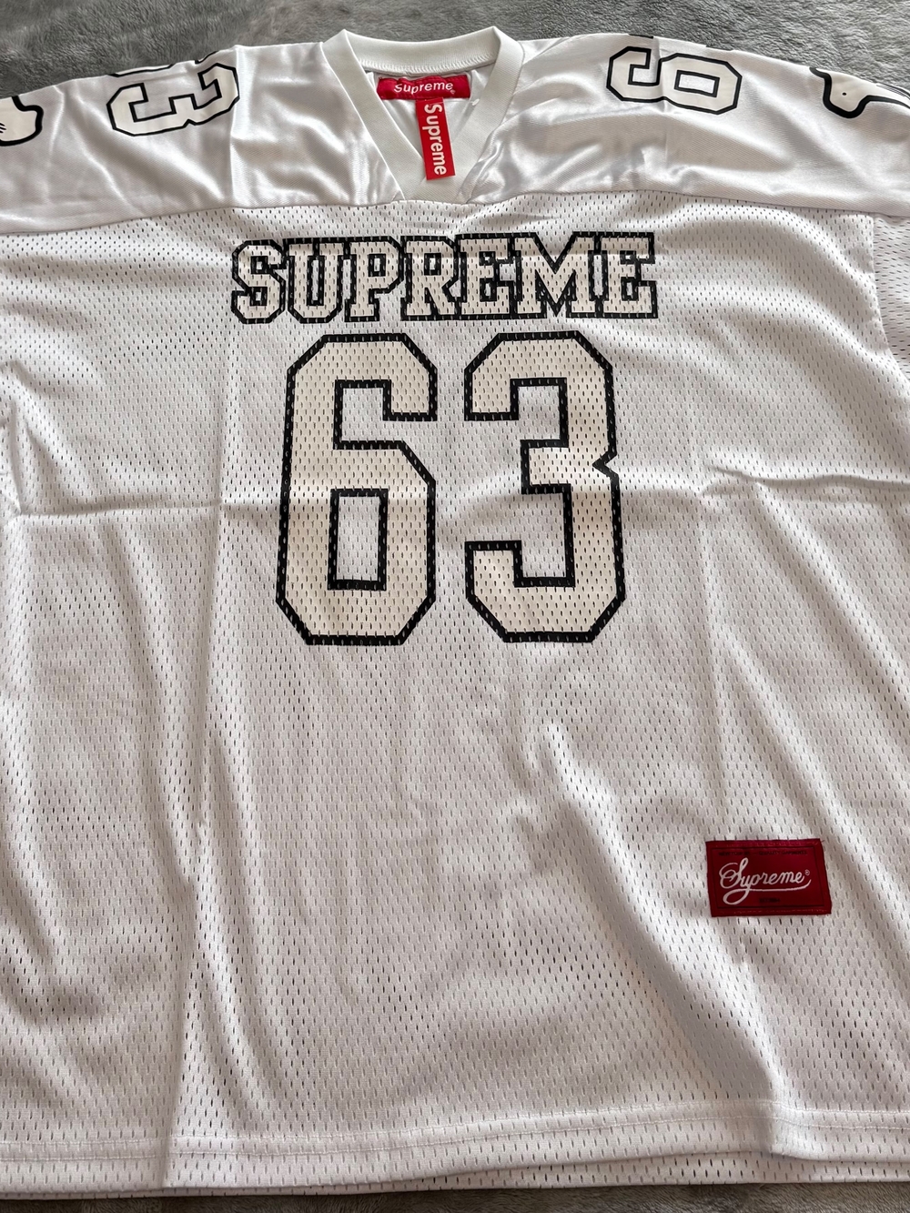 Supreme White Mesh Jersey Tee with 63 Graphic